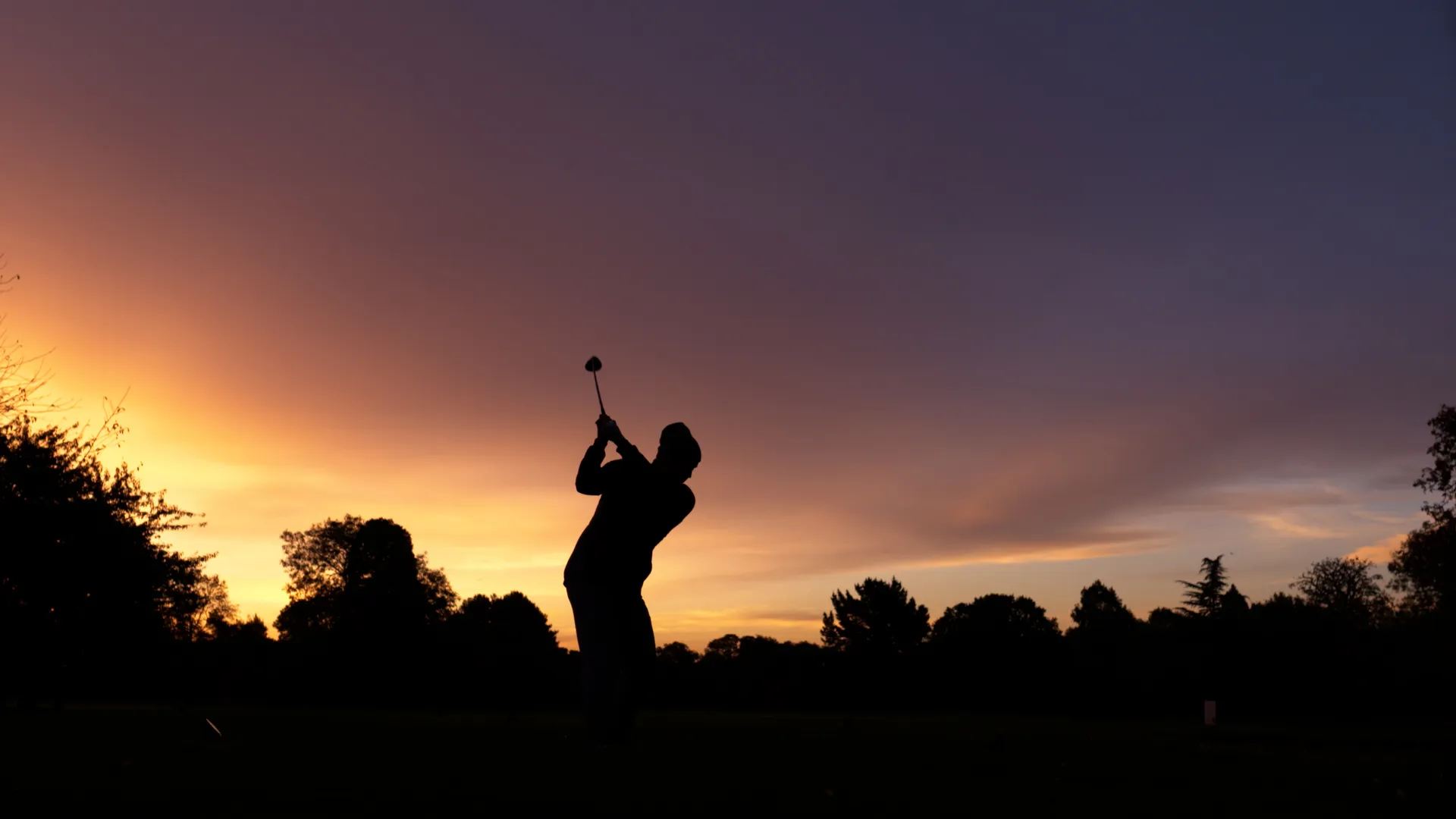 Original Ashford Manor case-study image of a golfer against a sunset.