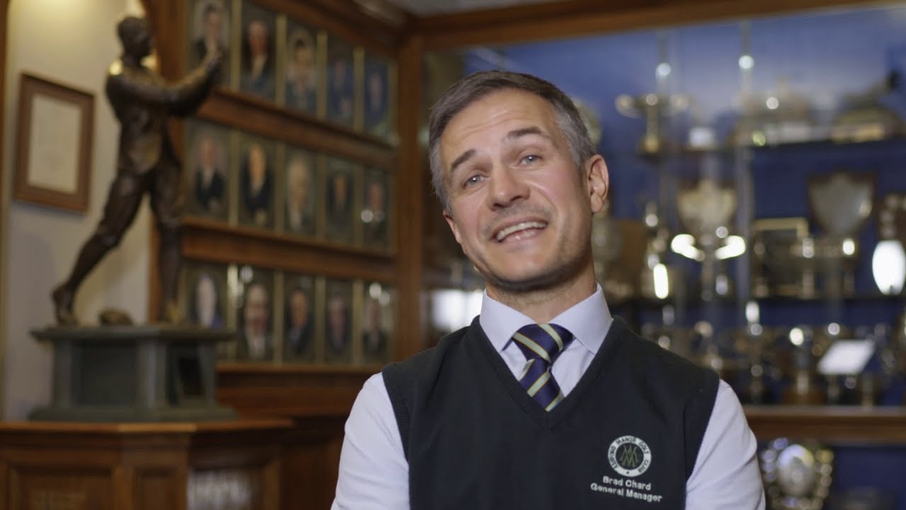 An Ashford Manor representative speaking in the clubhouse during a client testimonial.