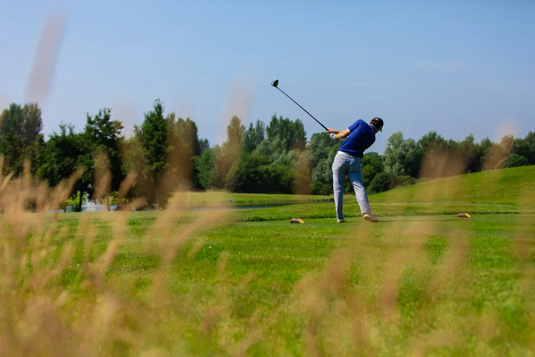 Golfer walking across Stonebridge Golf Club in original campaign photography.