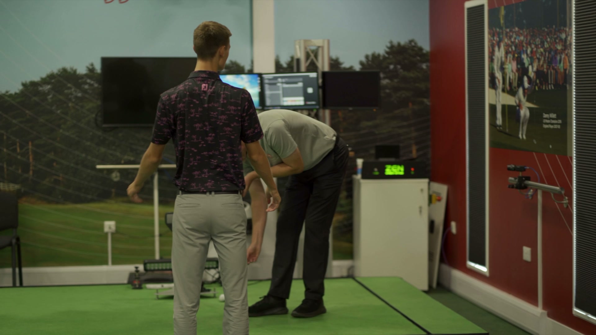 A golfer and coach working inside the Woodhall Spa performance centre.